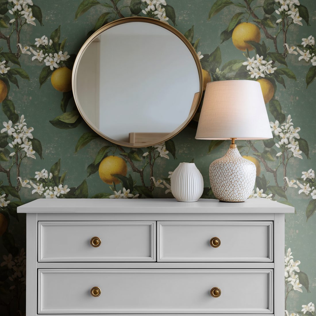 Citrus Bough wallpaper with lemons behind a white dresser