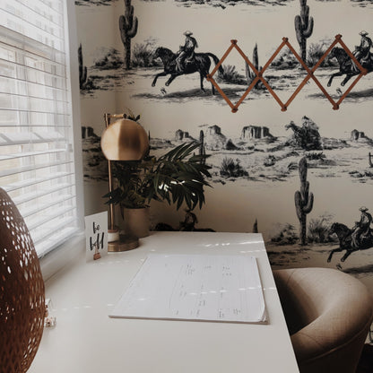 Western Toile Frontier Trail large scale wallpaper in a styled room
