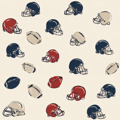 Navy, red and tan football helmets and small footballs scattered on a cream ground.